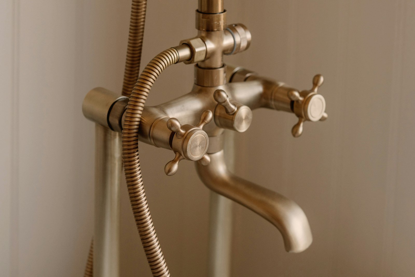 Old-style brass shower and bath taps in an older home